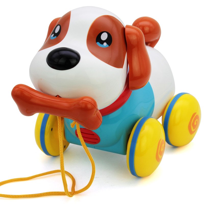 пластмассовая собачка с костью во рту на верёвке